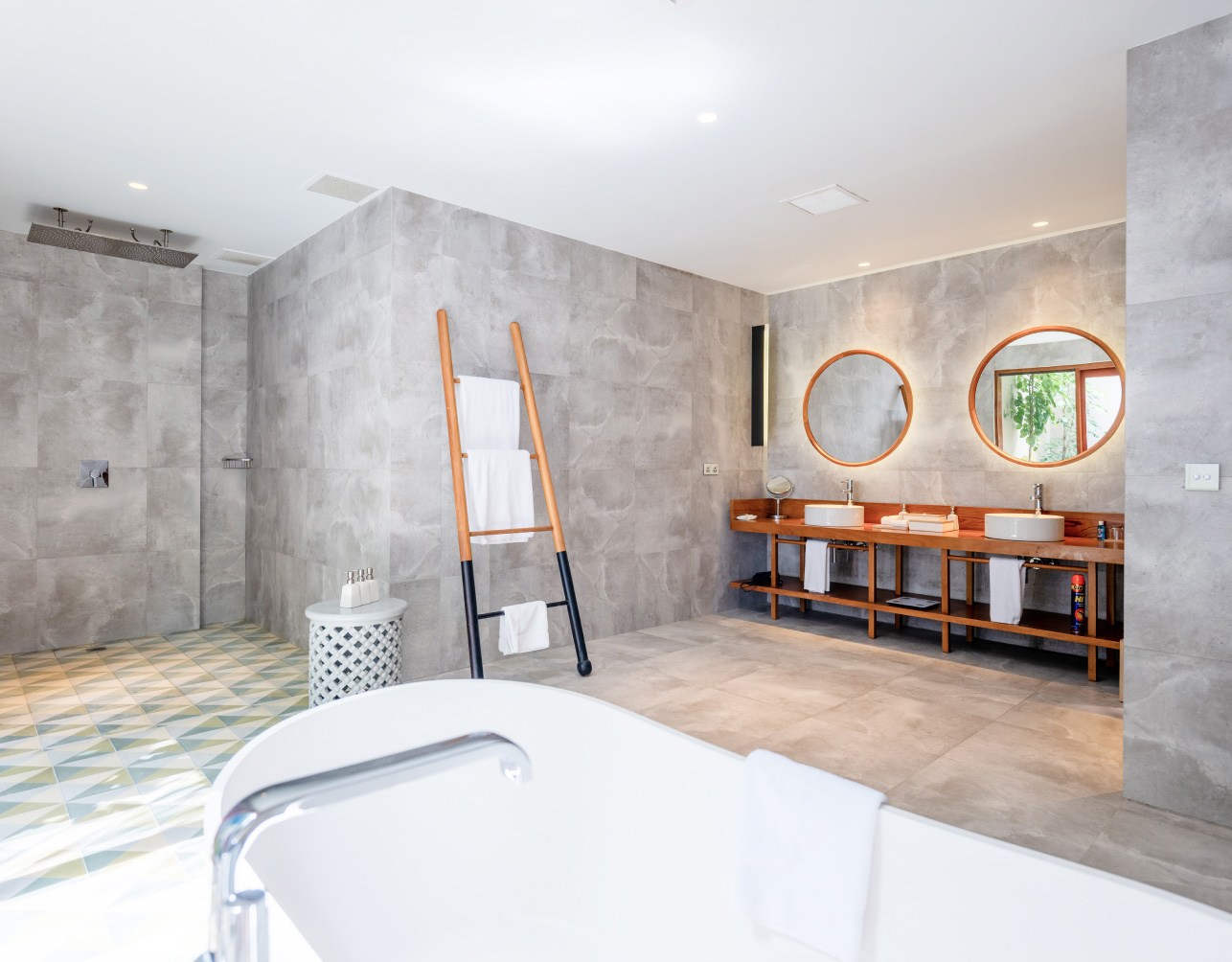 The full bathroom with spacious soaking tub for 2 and double sinks inside our 2 bedroom Maldives Beach Villa.