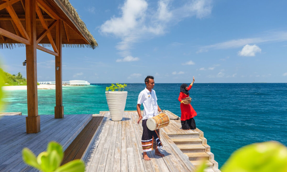 The Amilla staff welcoming guests to Amilla Resort and Residences.