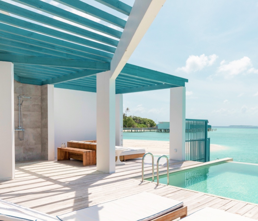 The al fresco dining area and outdoor rain shower located on the Sundeck of our 1 Bedroom Maldives Lagoon Pool Villa.