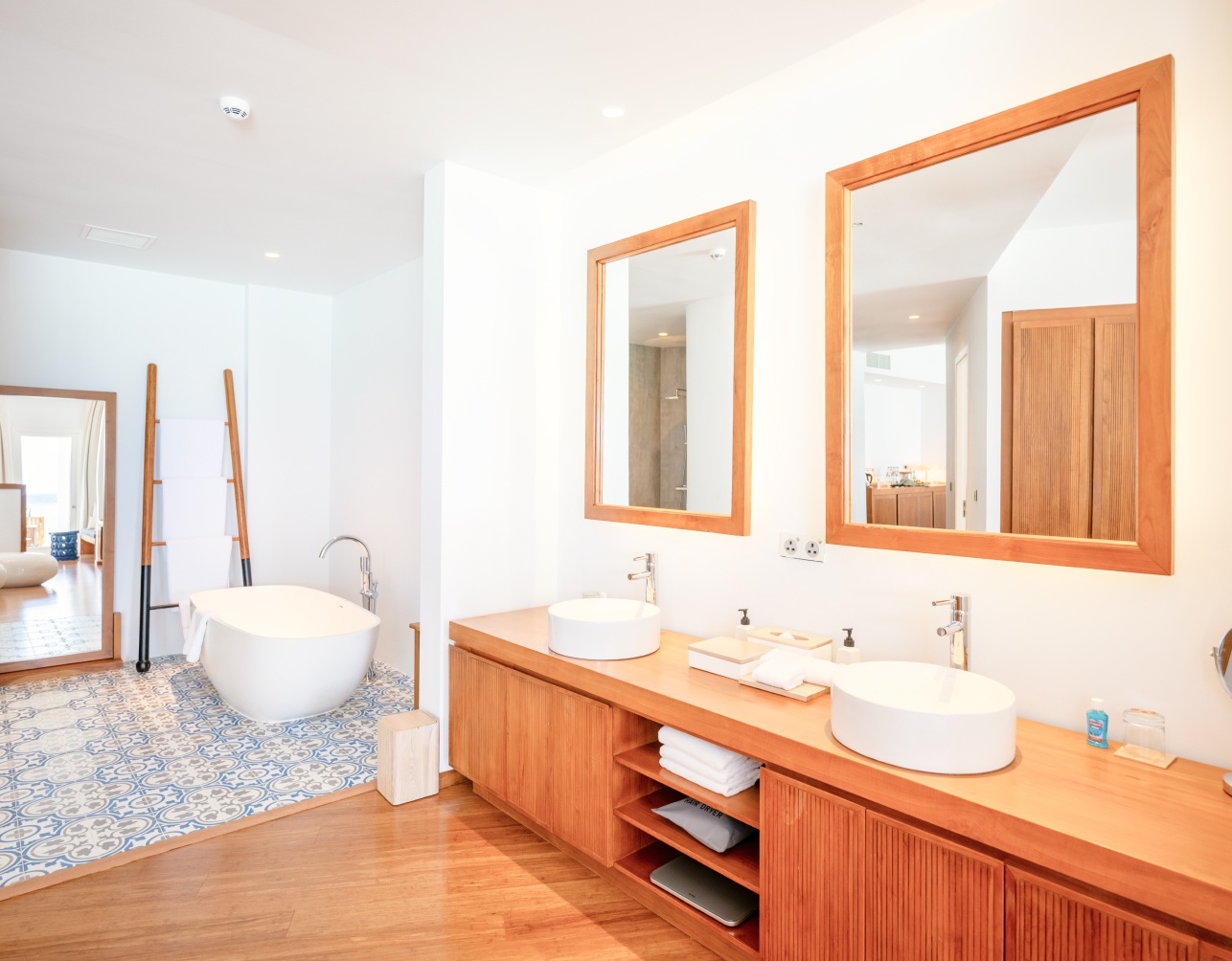 The full bathroom with spacious soaking tub for 2 and double sinks inside our 2 bedroom water villa in the Maldives.