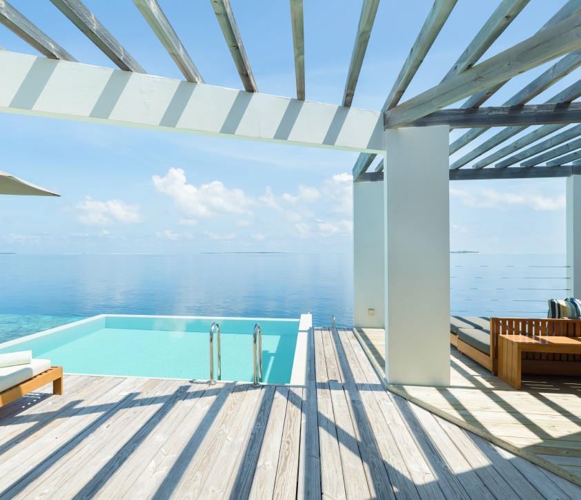 The sundeck and feshwater pool of our Maldives Water Villa with private pool.