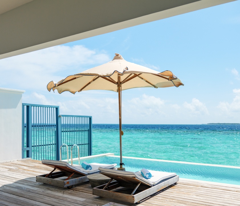 The sundeck and freshwater pool of our Sunset Water Villas Maldives.