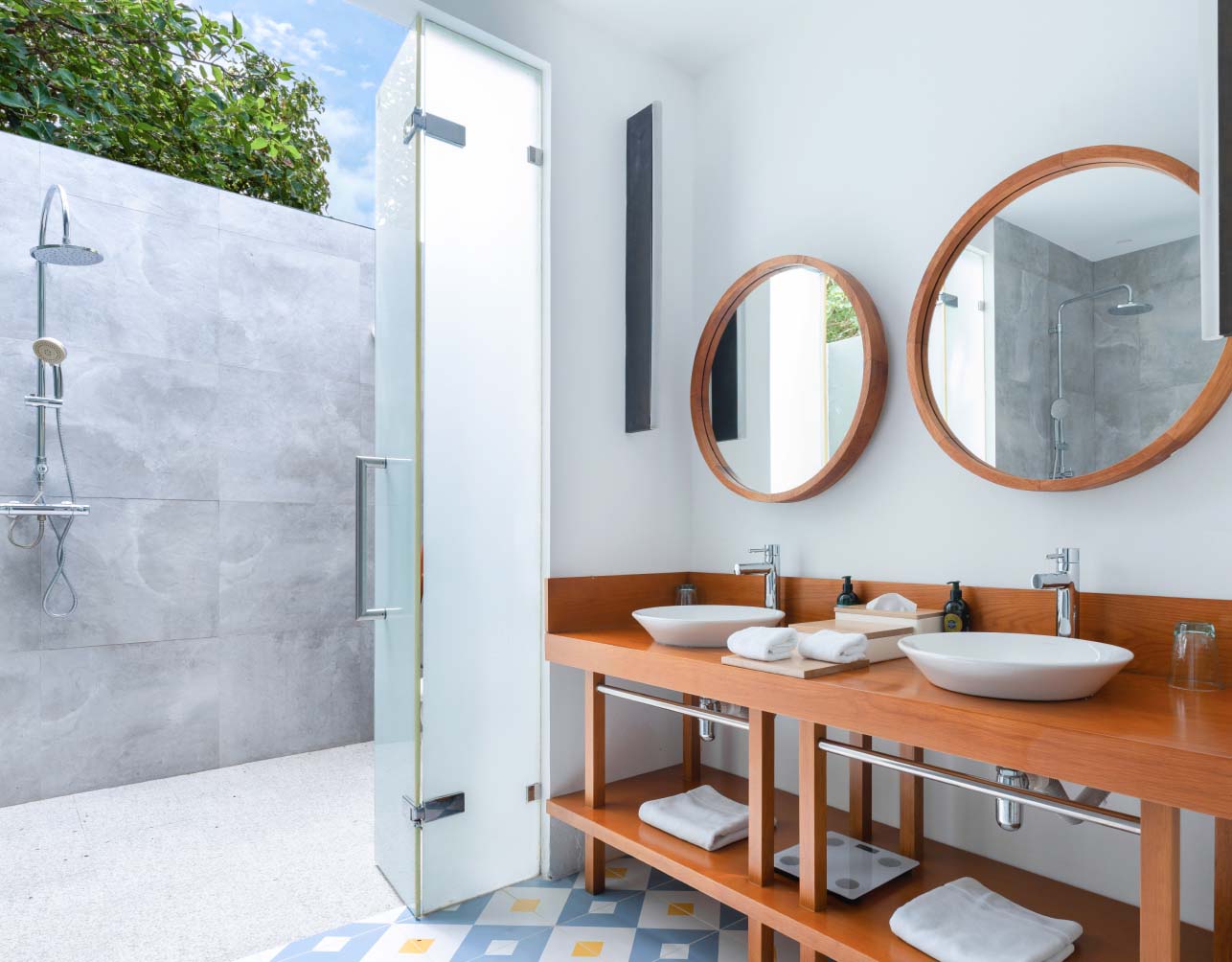 An outdoor garden shower just outside on of the spacious ensuite bathrooms in our Private Residence in the Maldives.