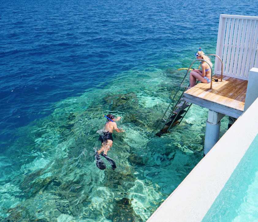 Snorkelling in the Maldives right from our Reef Water Villas.