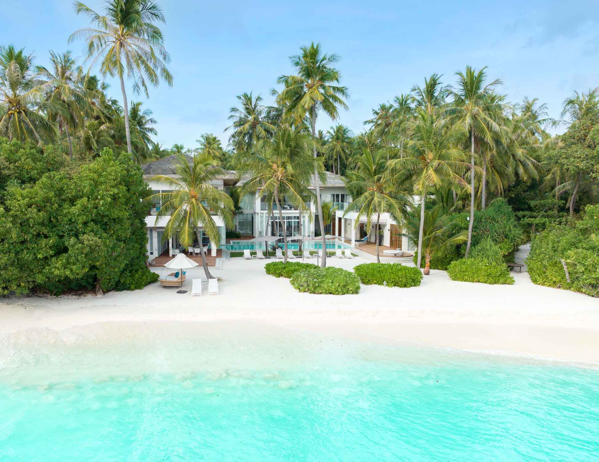 An exterior beachside view of the Amilla Estate - Our premier Maldives Family Accommodation