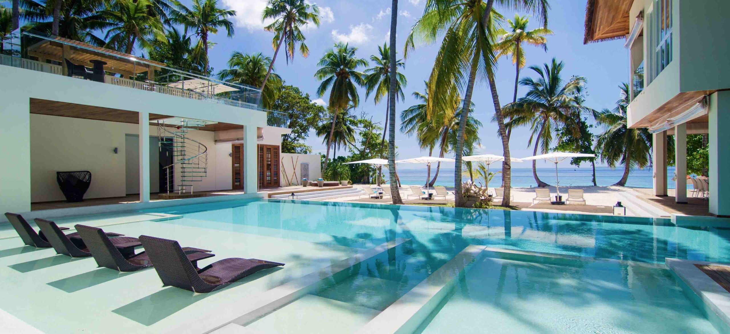 Poolside view of the Amilla Estate - The Mansion in the Maldives
