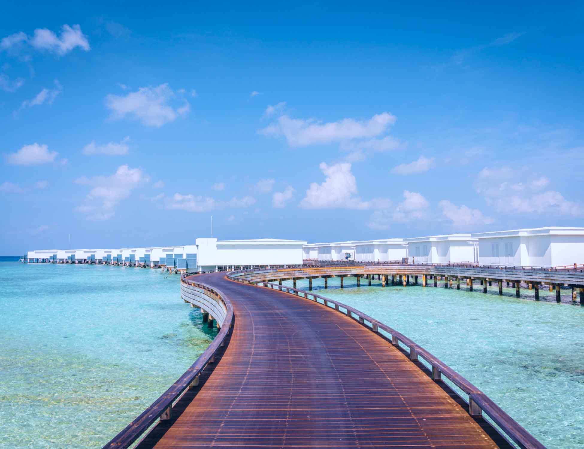 One of the many accessible pathways leading to the Maldives luxury villas, part of Amilla's accessible accommodations.