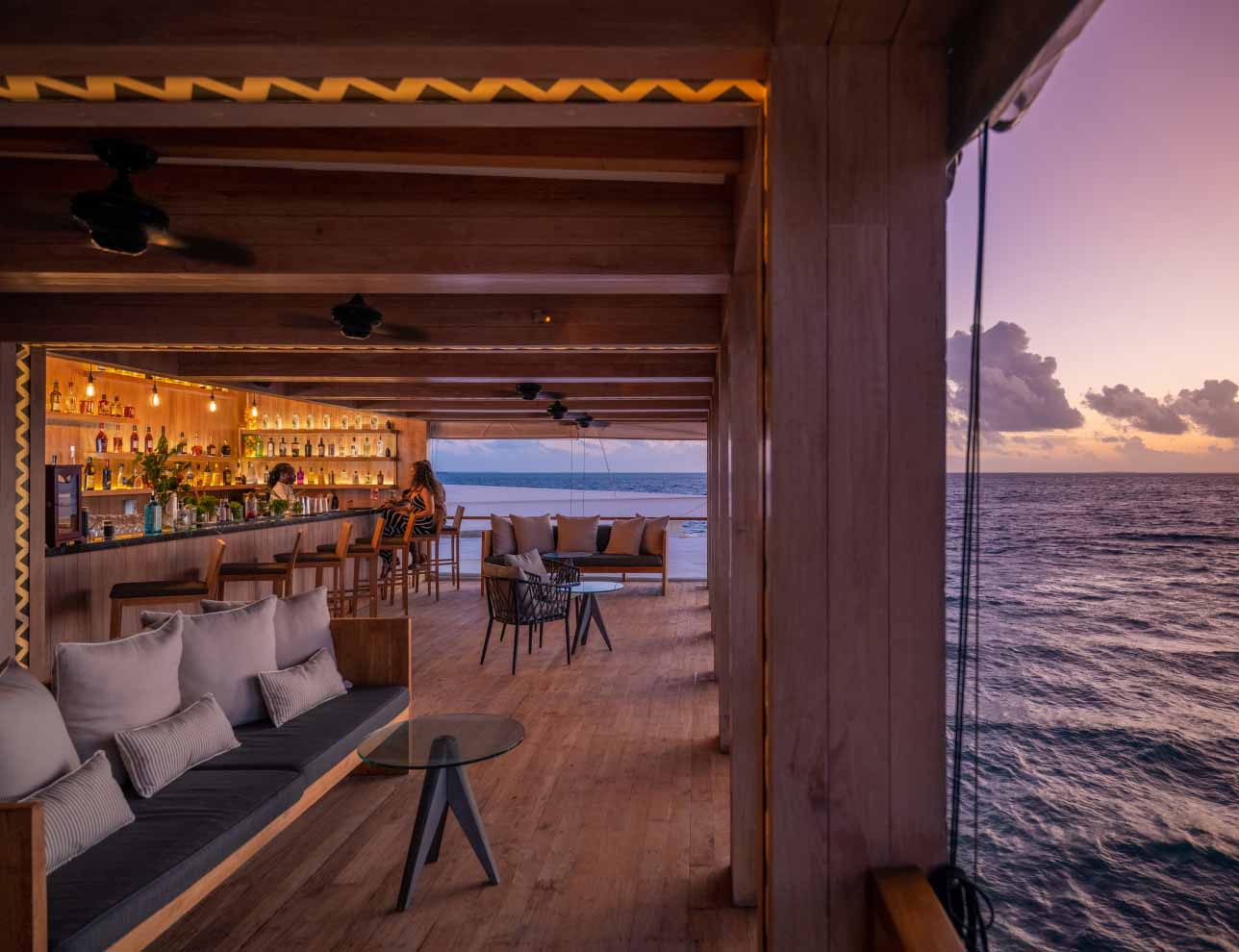 Amilla Maldives Sunset Bar overlooking the ocean.
