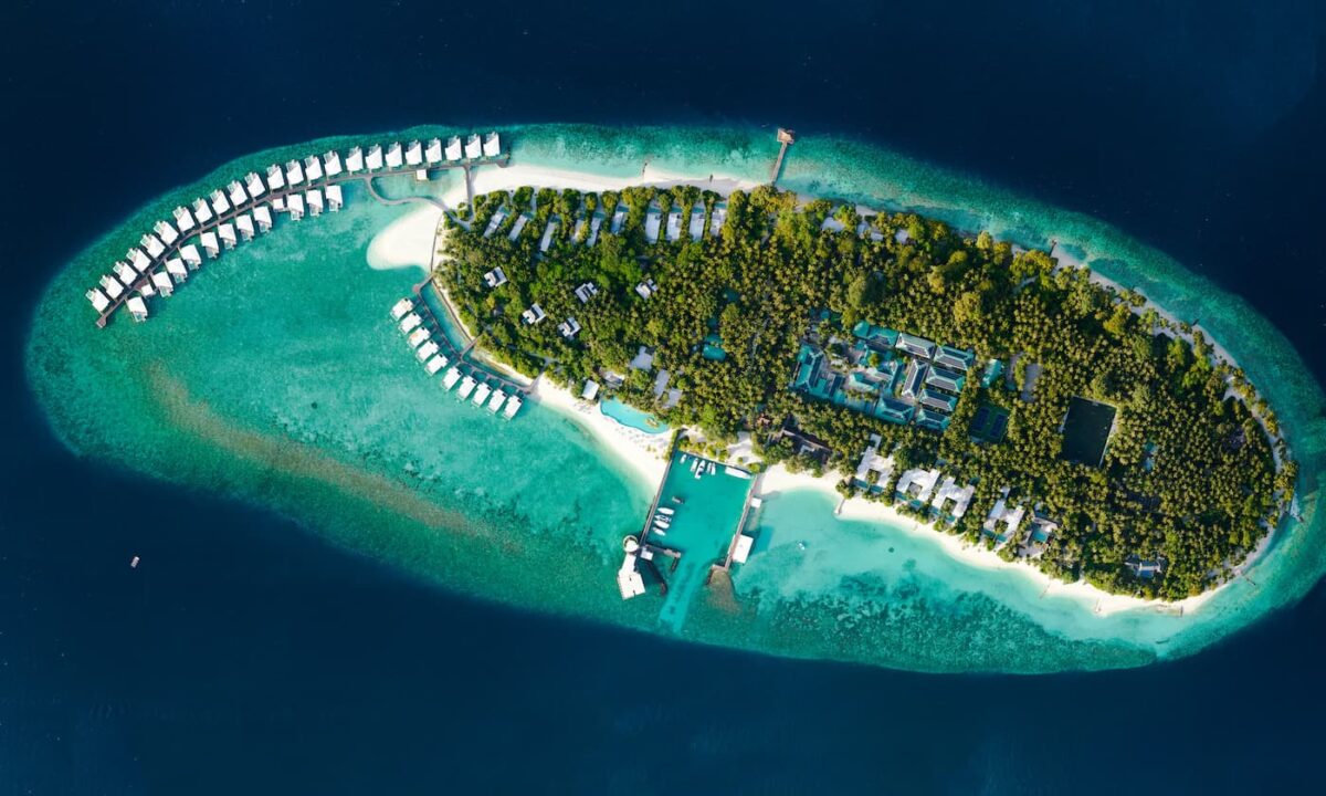 An overhead view of Amilla Fushi an eco-friendly resort focused on Maldives sustainability.