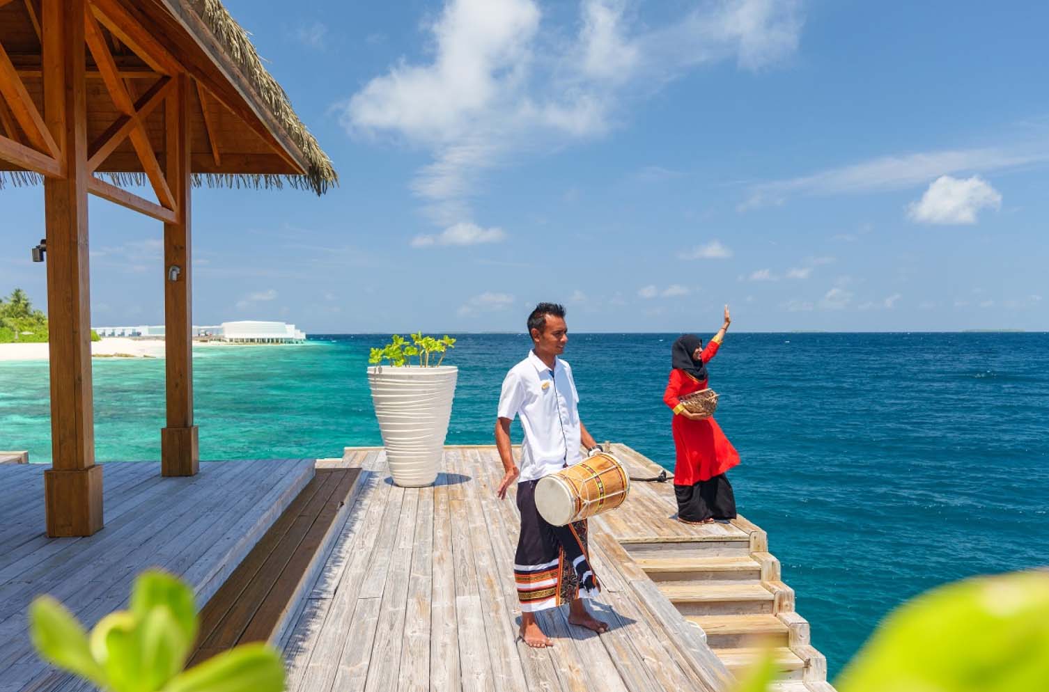 The Amilla staff welcoming guests to Amilla Resort and Residences.