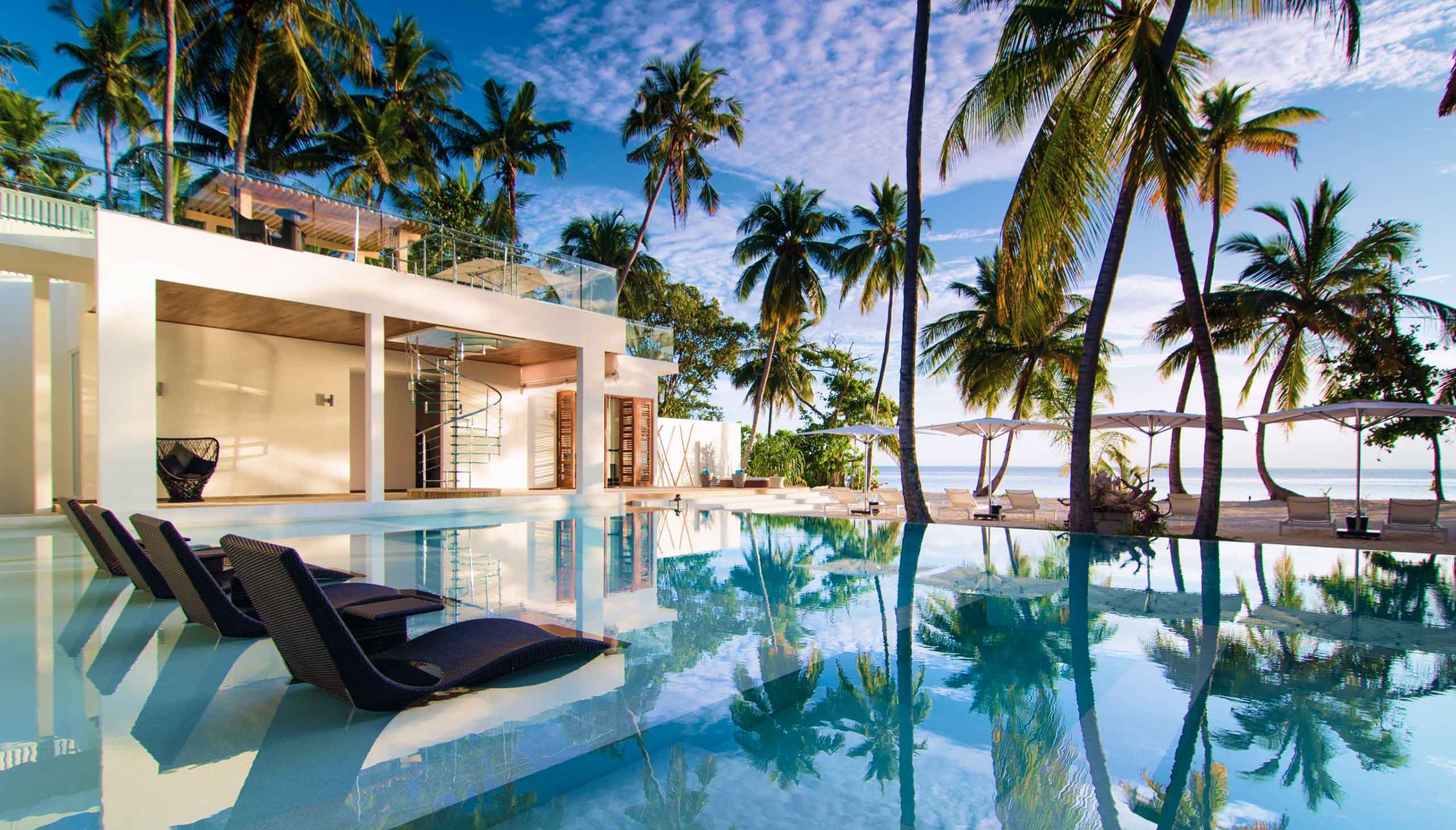 Poolside view of the Amilla Estate - Mansion in the Maldives