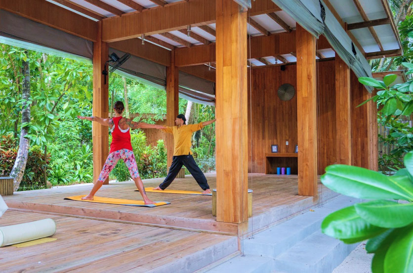A Private Yoga & Movement Session at Amilla Fushi, a luxury wellness resort