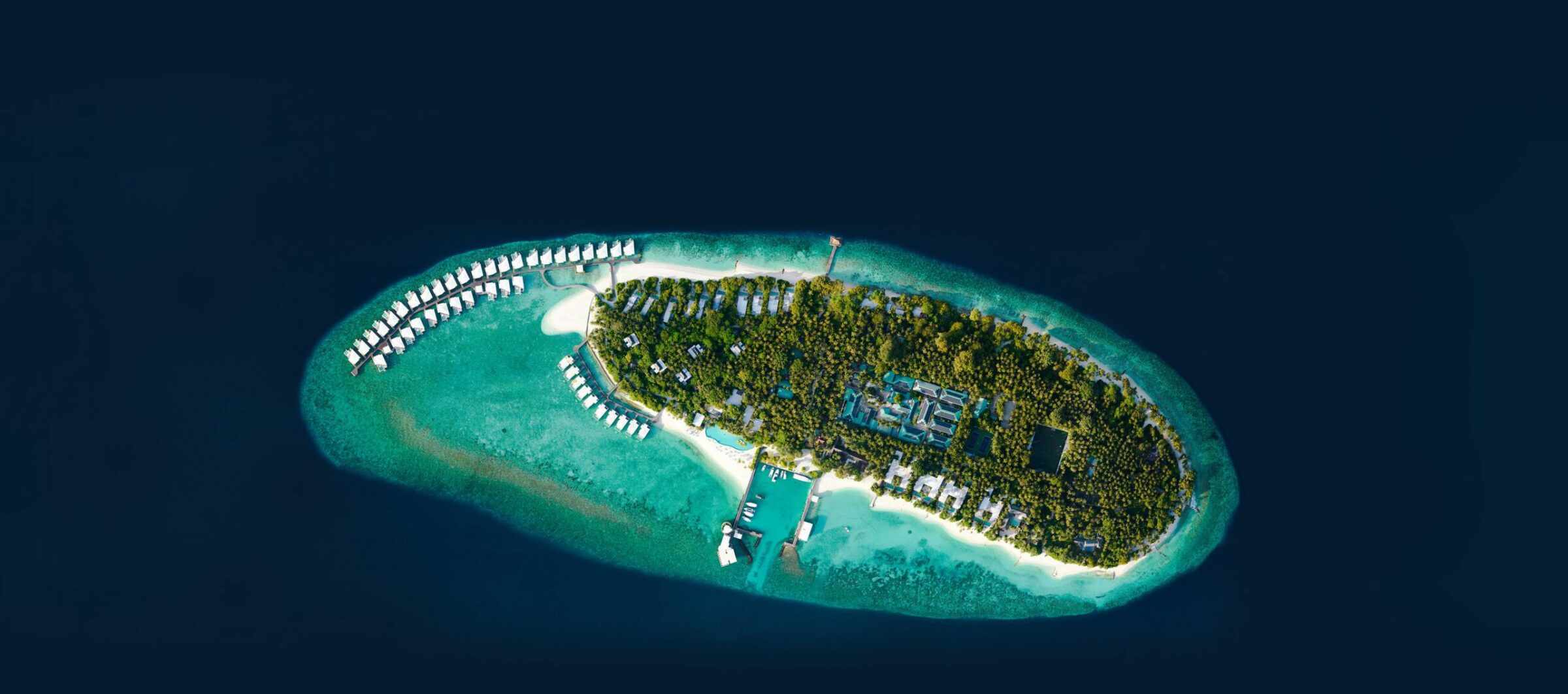 An overhead view of the Amilla Fushi an eco-friendly resort focused on Maldives sustainability.
